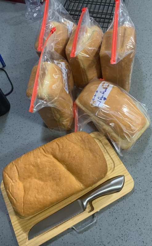 six loaves of sandwhich bread, five of which are bagged